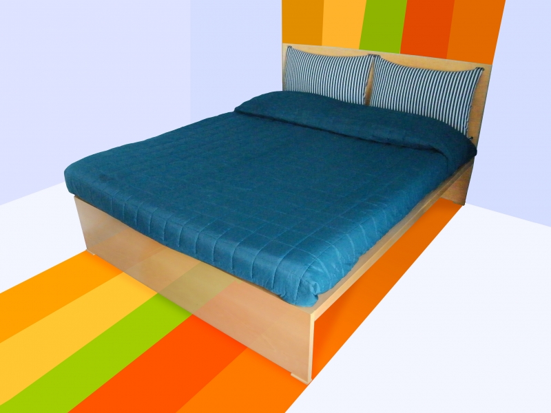 Letto Alessandro: foto del letto su sfondo arcobaleno.